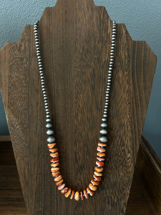 22" Graduated pearls with orange spiny