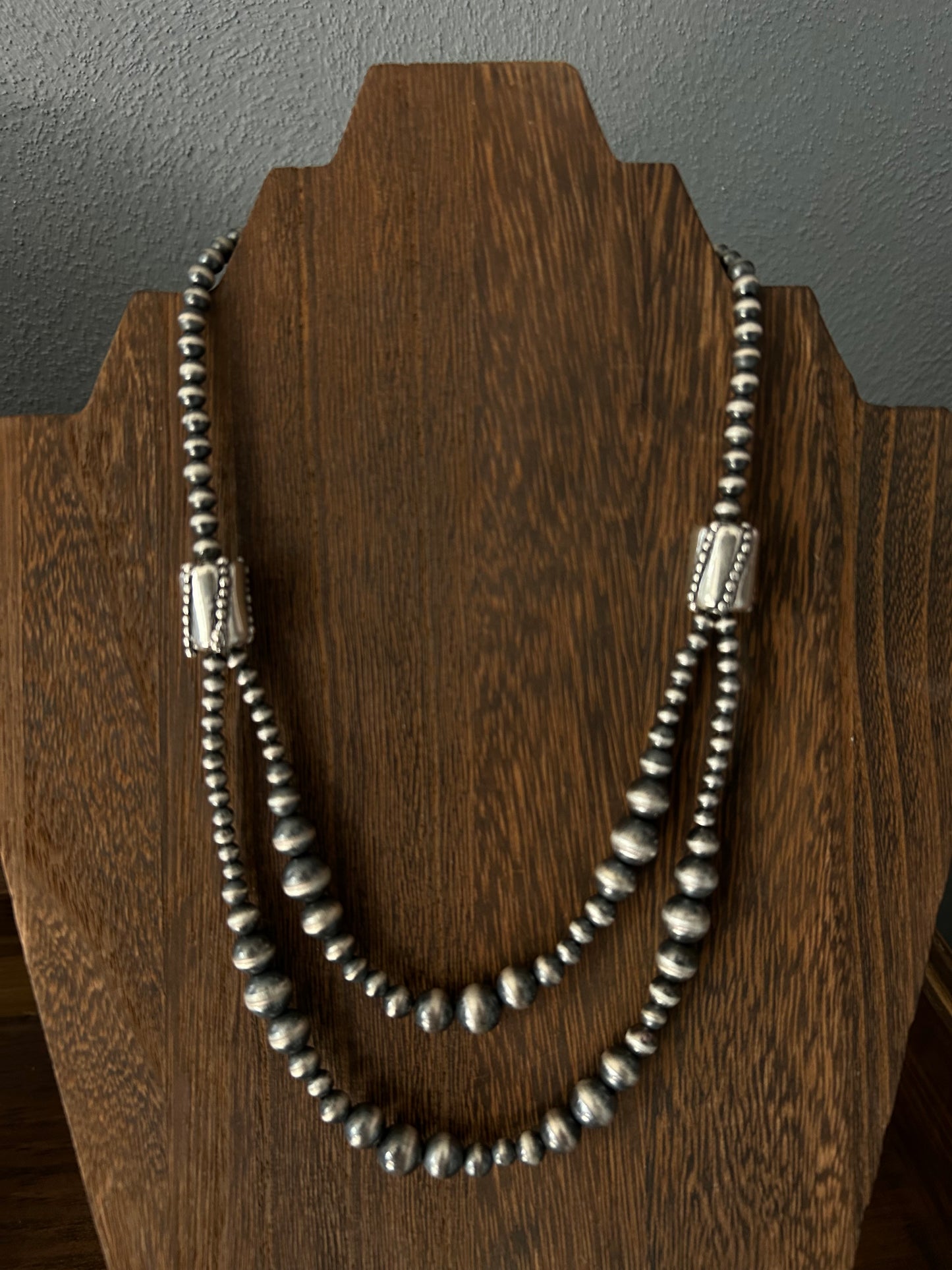 Double strand graduated barrel bead
